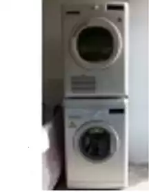 un lave- sèche linge blanc 9 Kg